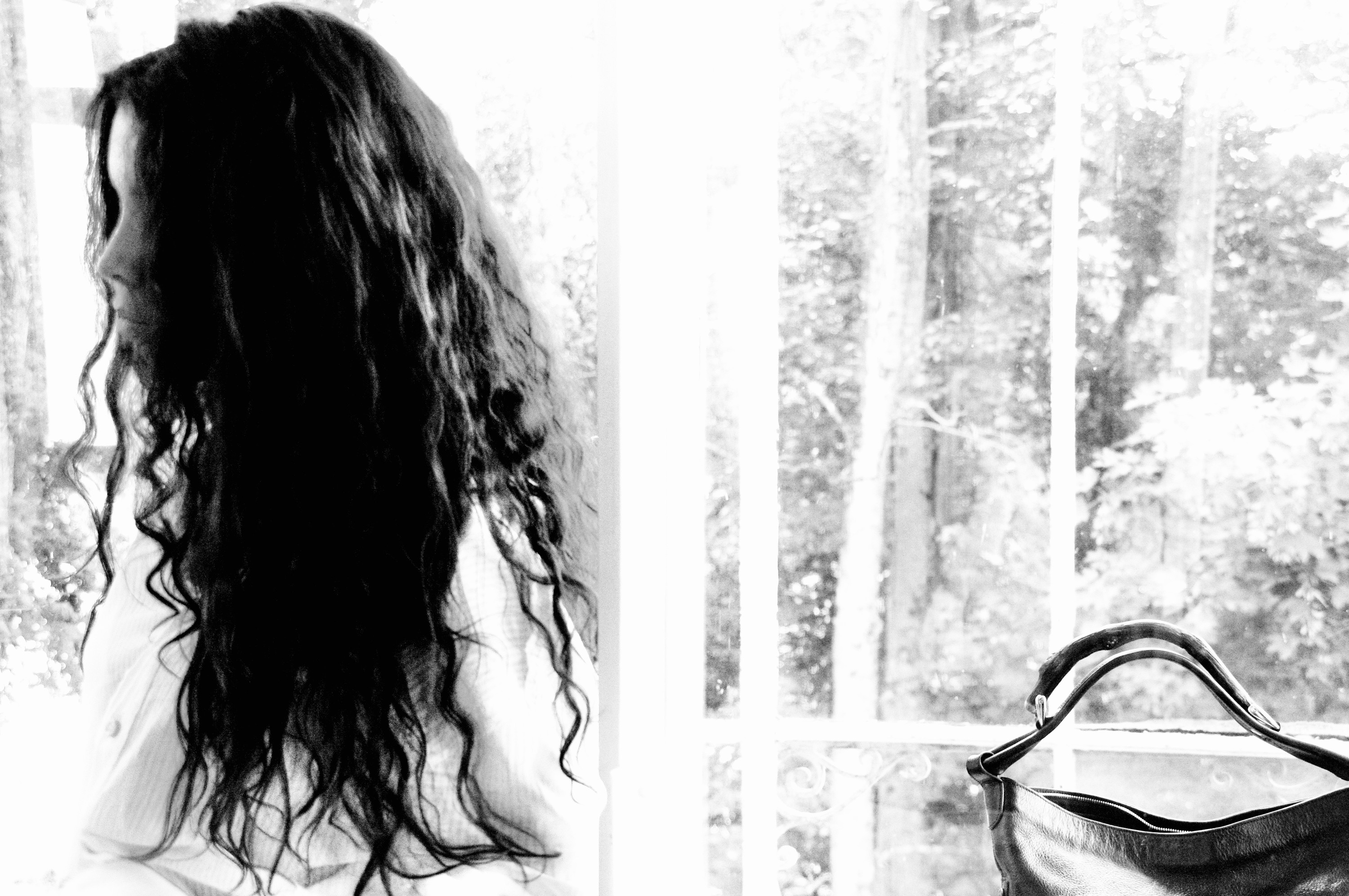 Camerone, long hair, by the window