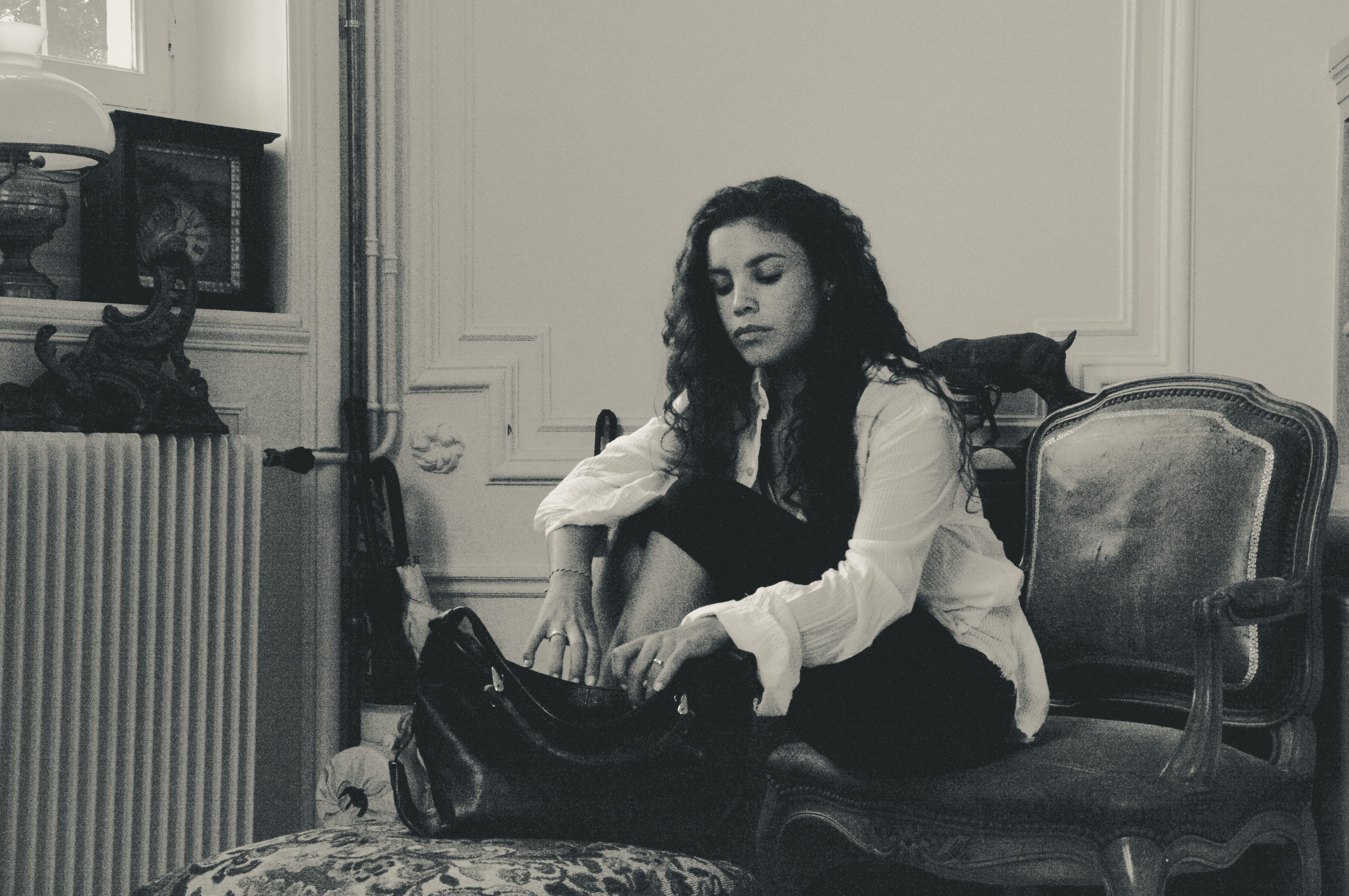 Camerone seated in the salon
