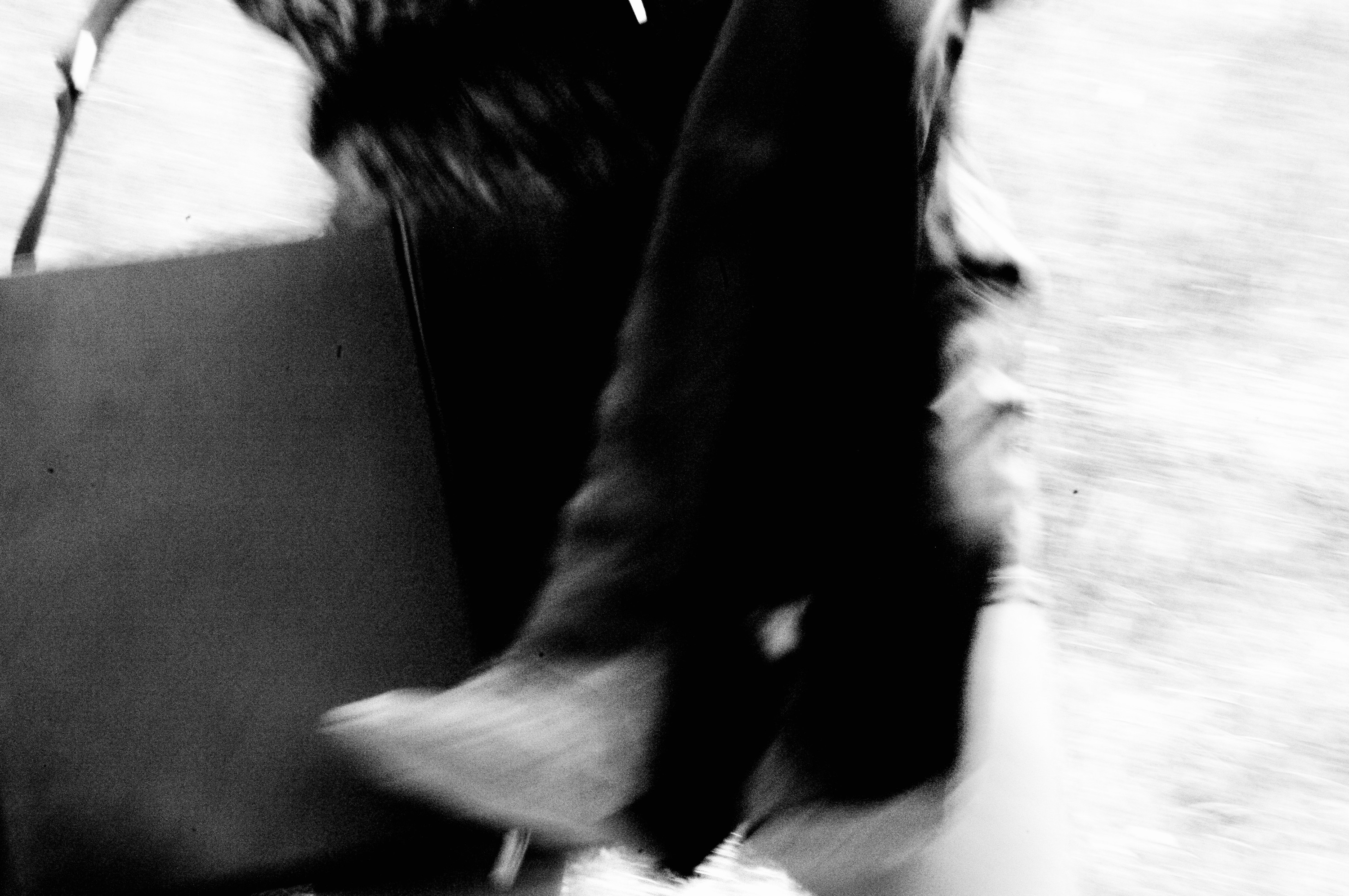 Walking, bag in hand — motion blur