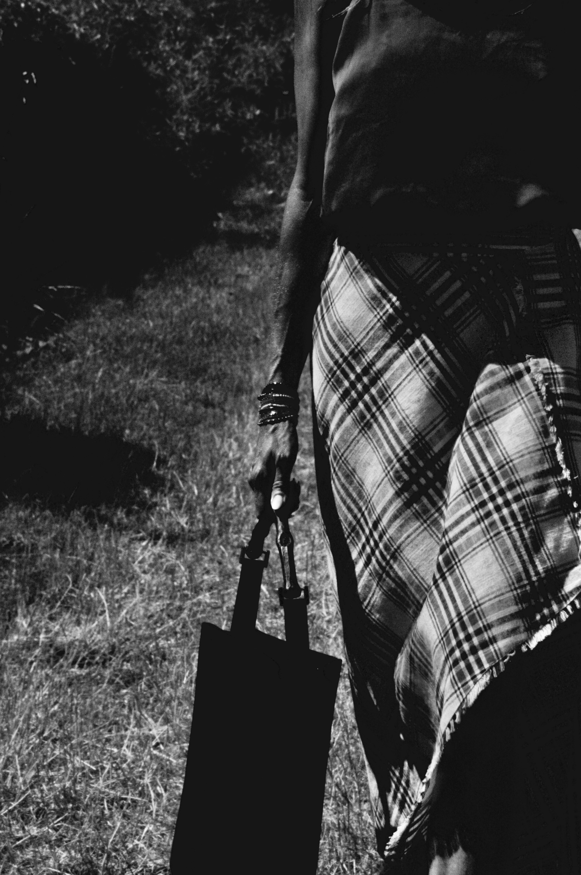 Tartan skirt and bag on the lawn
