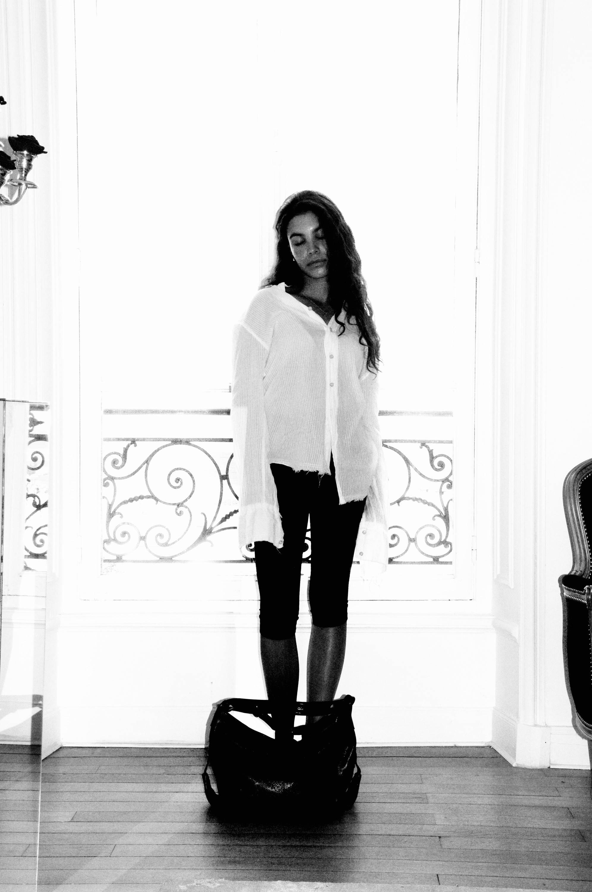 Standing at the balcony window